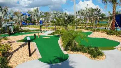 a golf course at a resort with a putting green at Strategic Condo 2 Bd Close to Disney Storey Lake in Kissimmee