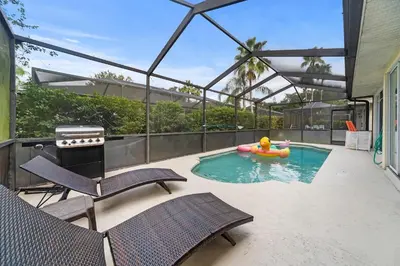 a swimming pool with a rubber duck in a raft at Lakeview Family Haven in Kissimmee - Pool & Scenic Views in Kissimmee