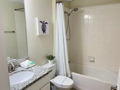 a bathroom with a sink and a toilet and a shower at Wonderful home close to disney & universal in Kissimmee