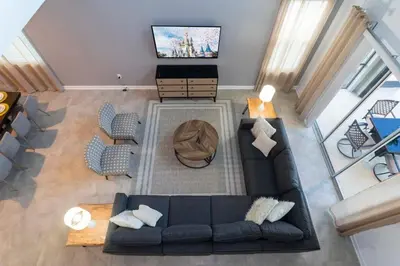 an overhead view of a living room with a couch and a television at Spacious & Comfy Retreat Prime Location Amazing in Kissimmee
