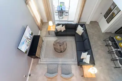 an overhead view of a living room with a black couch at Spacious & Comfy Retreat Prime Location Amazing in Kissimmee
