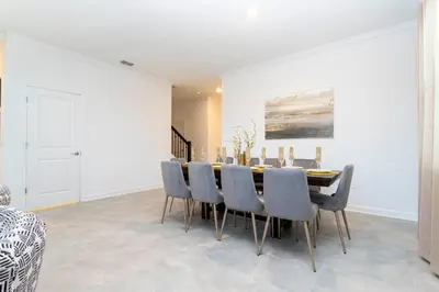 a dining room with a table and chairs at Spacious & Comfy Retreat Prime Location Amazing in Kissimmee