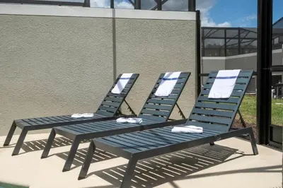 two blue chairs sitting next to each other on a baseball field at Fantastic 4 Bd w Pool at Storey Lake Resort 2709 in Kissimmee