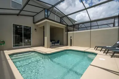 a swimming pool in a house with a glass ceiling at Fantastic 4 Bd w Pool at Storey Lake Resort 2709 in Kissimmee