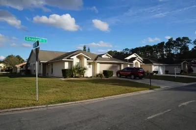 a street sign in front of a house at Christine's Villa in Kissimmee