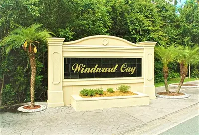 a sign for a windmill city with palm trees at Christine's Villa in Kissimmee