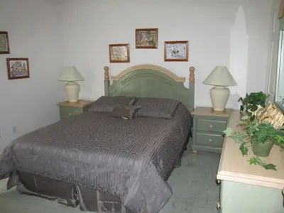 a bedroom with a large bed with two night stands at Captain Jack's Getaway in Kissimmee