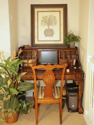 a wooden desk with a computer on top of it at Princess Hideaway in Orlando