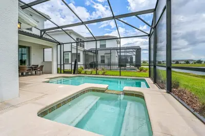 an image of a swimming pool in a house at Luxury Storey Lake Retreat - Spacious Disney-Near in Kissimmee