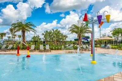 a pool with water fountains in a resort at Private Pool Prime Location Beautiful Home in Kissimmee