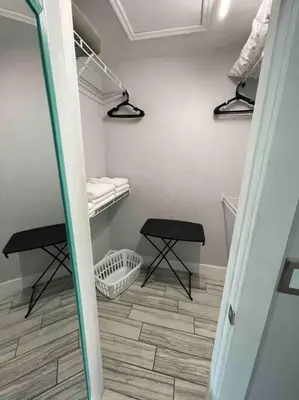 a room with two stools and a laundry room with a room at Luxury Waterfront 3b2b Heated Pool , Game Room , Piano House in Kissimmee