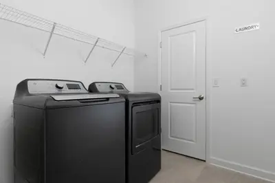 a black appliance in a room with a door at Chic & Spacious Best Vacation Home in Kissimmee