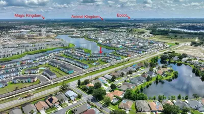 an aerial view of a city with a river at Surfstyle at Margaritaville by Shine Villas 022 villa in Orlando