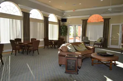 a living room with a couch and a table and chairs at 1320 - Aladin Cozy Bella Vida Kissimmee Close Disney in Kissimmee