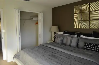 a bedroom with a large bed in a room at 1320 - Aladin Cozy Bella Vida Kissimmee Close Disney in Kissimmee