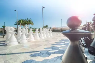 a large chess board with a person in the middle at Elegant Home w 3 En Suites & Breathtaking View in Orlando