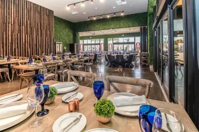 a dining room with wooden tables and chairs at Elegant Home w 3 En Suites & Breathtaking View in Orlando