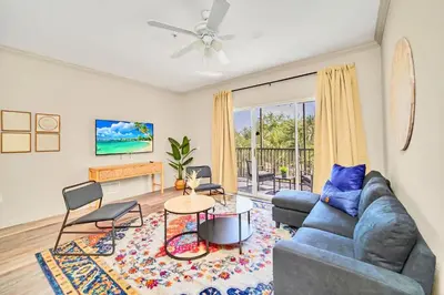 a living room with a couch and a table at Near Disney - 2BR Condo Unit - Pool in Orlando