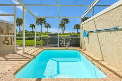 a swimming pool in the backyard of a house at Magical Serenity in Orlando