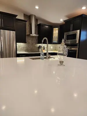 a kitchen with a white counter top and a sink at The Villa Orlando College Park Sleeps16 - Monthly Stays in Orlando