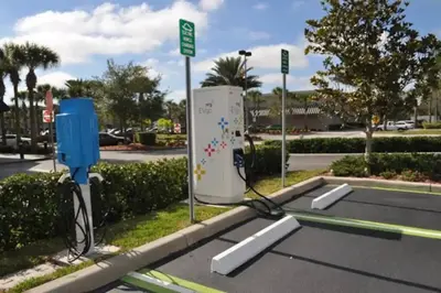 a gas pump in a parking lot next to a street at Exquisite 3 Bdr Condo Minutes to Disney in Orlando