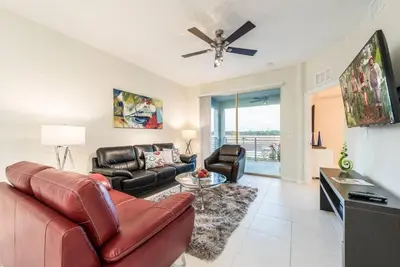 a living room with a couch and a ceiling fan at Apartment 3BR Great Location - Super Comfort in Kissimmee