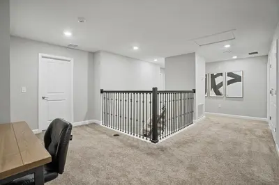 a dog sitting in a room with a fence in it at New Home 8 Bedrooms and 5 Bathrooms At Storey Lake in Kissimmee