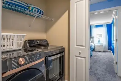 a kitchen with a stove and a microwave at Family Retreat near Disney with Pool & Hot Tub! in Kissimmee