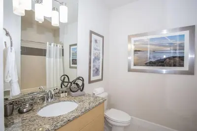 a bathroom with a sink and a toilet at Charming Cozy Haven in Orlando