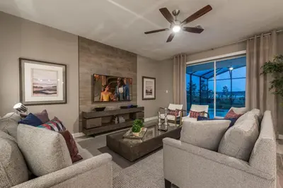 a living room with two couches and a ceiling fan at Chic Luxury Haven - Unforgettable Retreat in Kissimmee