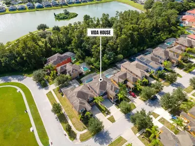 a sign that reads war house in front of houses at Enjoy the Large Pool - 6BR BL220 in Kissimmee