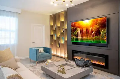 a living room with a flat screen tv above a fireplace at Storey Lake House 2713 in Kissimmee