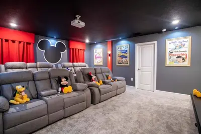 a movie room with couches with stuffed animals on them at Storey Lake House 2713 in Kissimmee