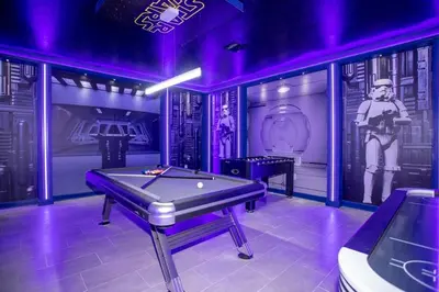 a purple room with a pool table in it at Storey Lake House 2713 in Kissimmee