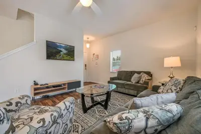 a living room with two couches and a table at Remodeled Gem - Comfort & Location in Kissimmee