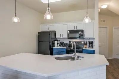 a kitchen with a sink and a counter top at Remodeled Gem - Comfort & Location in Kissimmee