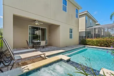 a swimming pool in front of a house at 8 Bd home with Themed rooms and Pool 2308 in Orlando