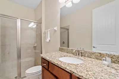 a bathroom with a sink and a toilet and a shower at 8 Bd home with Themed rooms and Pool 2308 in Orlando