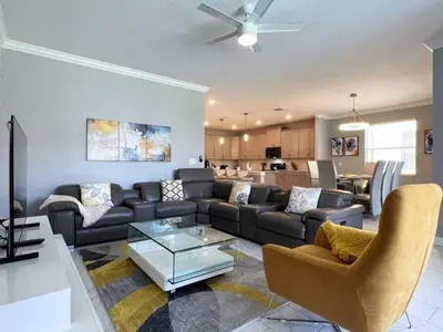 a living room with a couch and a table at Disney World-House Up to 18 ppl at Storey Lake-Cloud9 in Kissimmee