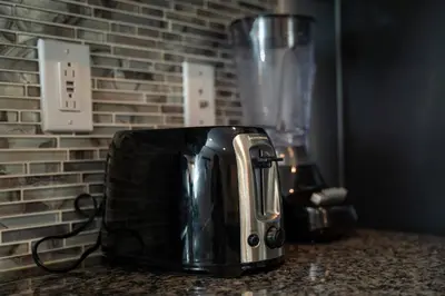 a toaster sitting on a counter next to a blender at Home with a pool at Storey Lake Resort in Kissimmee
