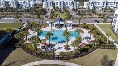 an overhead view of a pool at a resort at Home with a pool at Storey Lake Resort in Kissimmee