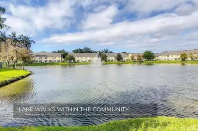 a lake within the community of lake walks within the community at Stunning 3BD Condo 14 Mins to Disney World , Gated in Kissimmee