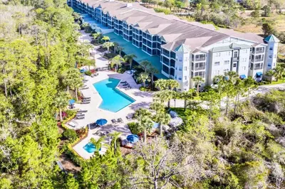 an aerial view of a resort with a swimming pool at Modern 2BR Condo - Pool - Near Disney in Orlando