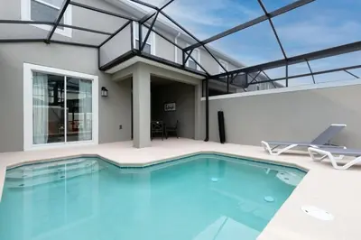 a swimming pool in a house with a glass ceiling at Modern Chic-Spacious, Private Pool, Prime Location in Kissimmee