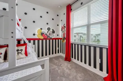 a nursery with two bunk beds and red curtains at Modern Luxury Retreat - Mickey & Harry Potter Beds in Orlando