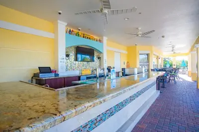 a bar in a restaurant with a counter top at Central Elegance-Spacious Beautifully Decor Condo in Orlando