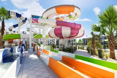 a water park with a roller coaster at Villatel Orlando Resort in Orlando