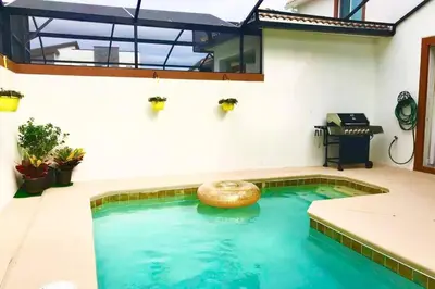 a swimming pool in the middle of a house at Vacation Bliss-Prime Resort Unbeatable Location in Kissimmee