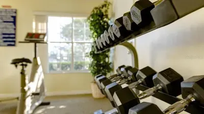 a room with a row of chairs in a gym at Gorgeous Place Minutes Away from Attractions in Kissimmee