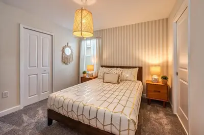 a bedroom with a bed and a chandelier at Chic Luxury Decor Prime Location Game Room Bliss in Kissimmee